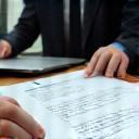 Clients reviewing clear contract documents